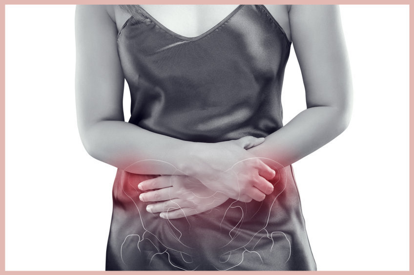 The photo of pelvic is on the woman's body, isolate on white background, Female anatomy concept